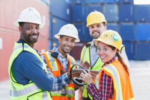Group-of-estimators-on-jobsite2 Estimators-smiling-on-a-jobsite