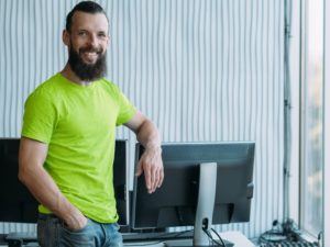 Smiling-customer-in-his-estimating-office-lime-cropped Smiling-customer-in-his-estimating-office-lime-cropped